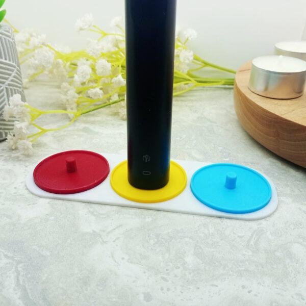 A three person Philips Sonicare electric toothbrush holder