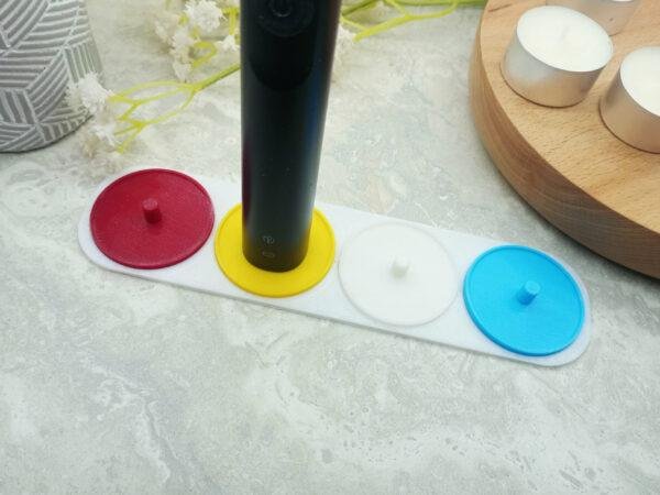 A 4 person electric toothbrush holder compatible with Philips Sonicare toothbrushes. Personalised with coloured holders.