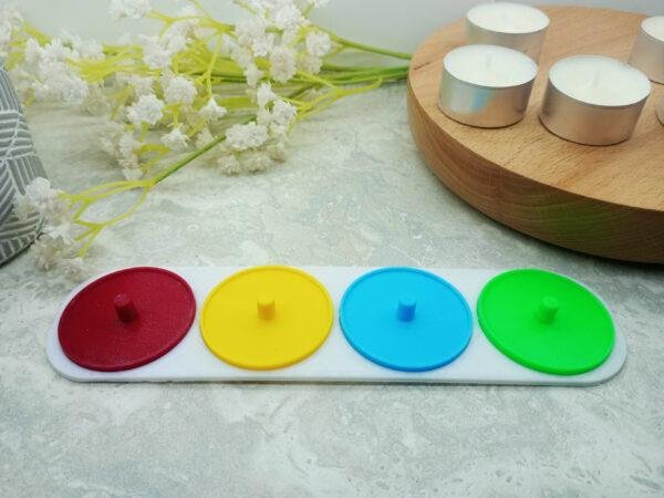 Four person electric toothbrush holder personalised in red green, yellow and blue.