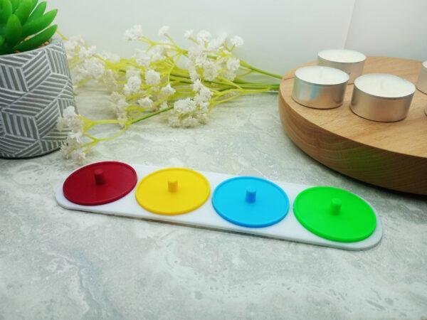 Four person electric toothbrush holder personalised in red green, yellow and blue.