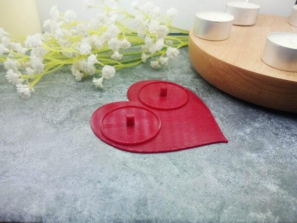 The deep red colour of the Philips, 2 person electric toothbrush holder is contrasted against the marble background. Standard size tealights are included to provide a sense of perspective. Fun valentines day gift. Red, heart shaped Philips electric toothbrush holder.