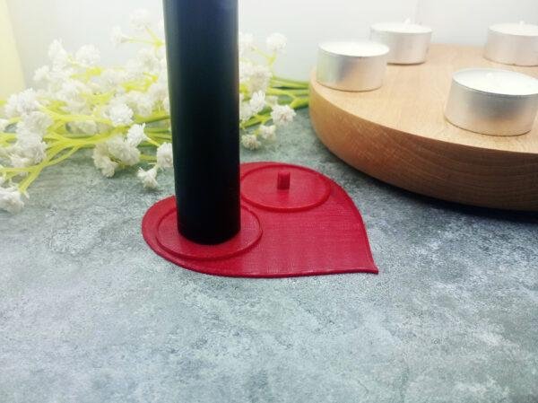 The heart shaped, couple's electric toothbrush holder is shown from above with an Philips electric toothbrush in place for a sense of scale. Whether as a fun anniversary present or a gift just to say I love you the heart holder fits the bill. Red, heart shaped Philips electric toothbrush holder