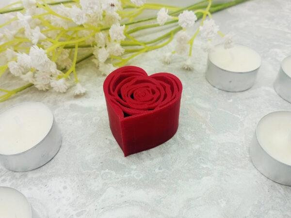 The heart shaped box is clearly displayed with the black showing through the rose filigree of the lid. The potential for this presentation gift box to be used for marriage proposals or as an anniversary gift to make a ring even more special is clear.